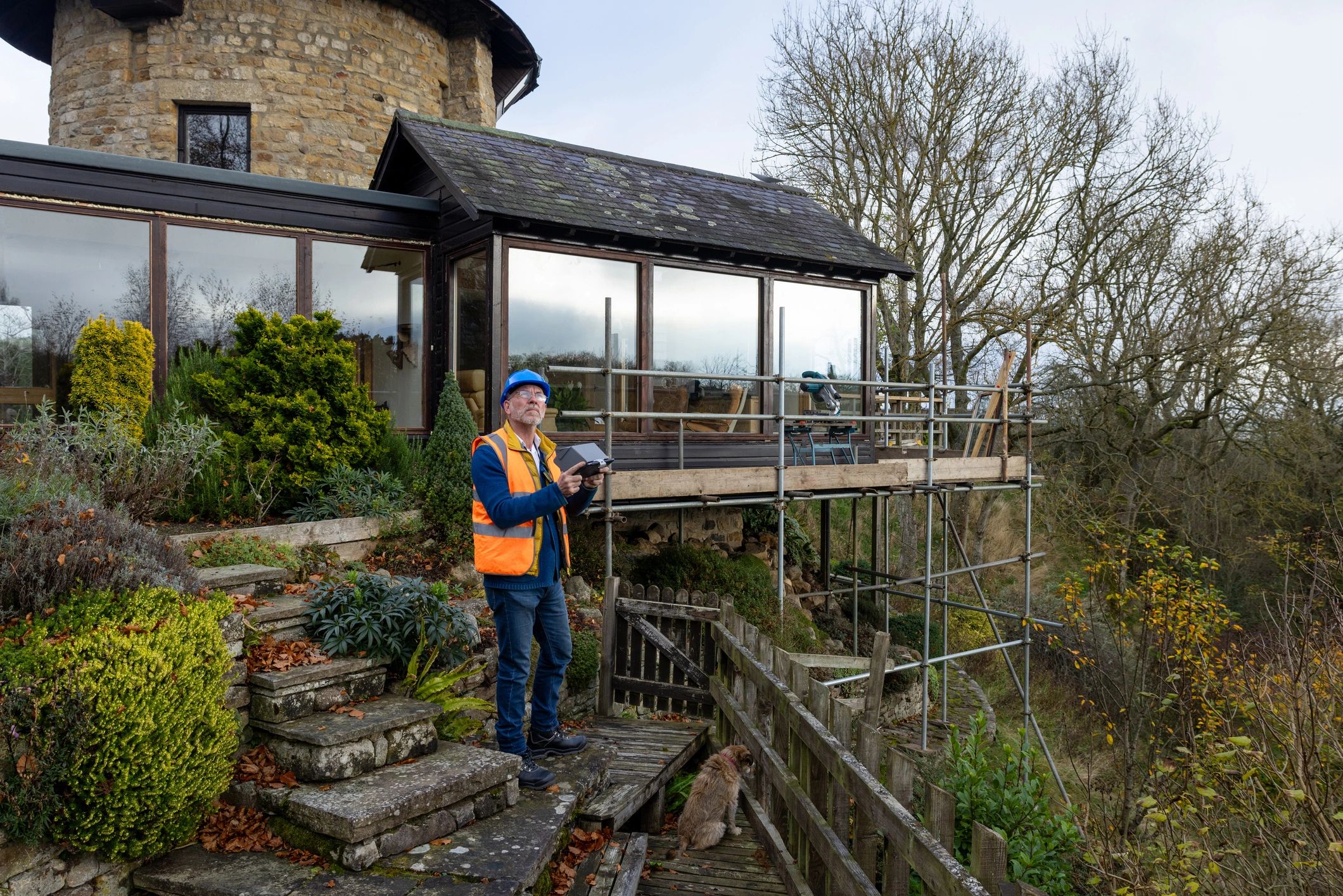 Inspector operating a drone to survey a property
